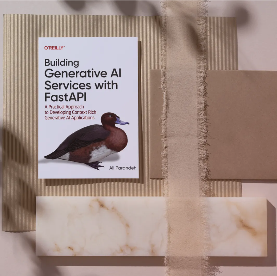 A portrait of the Building Generative AI Services with FastAPI book sitting on the floor
